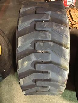 (4) CATERPILLAR Pneumatic Skid Steer Rims and Tires***LIKE NEW***