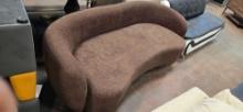 Brown curved sofa