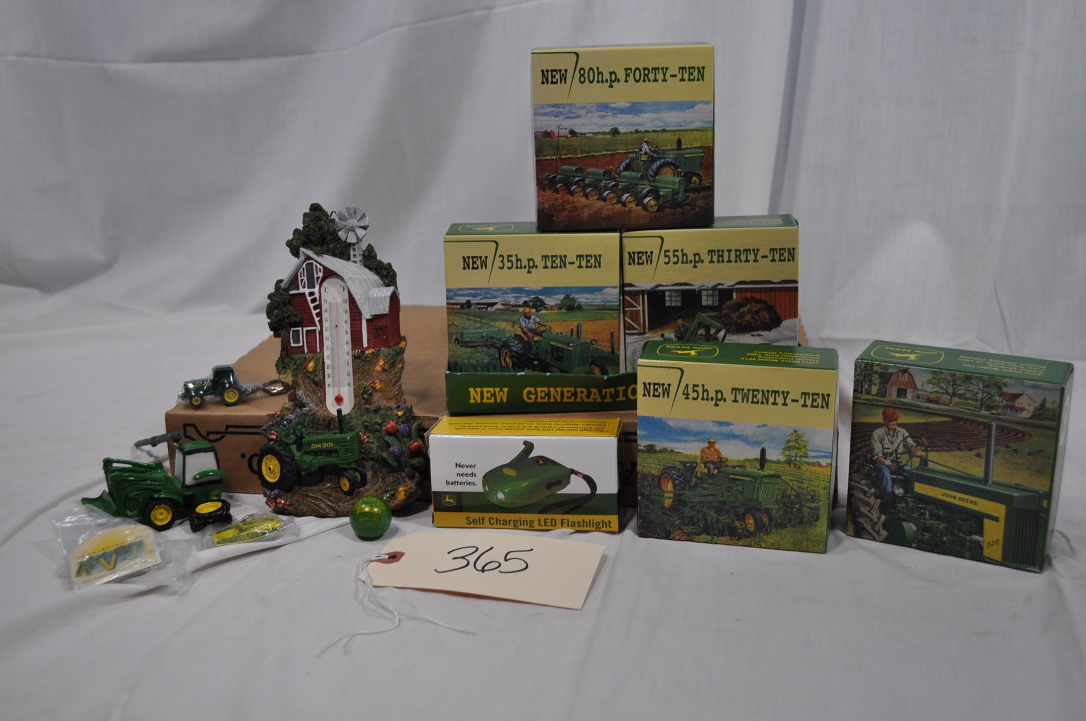 5 John Deere little puzzles, tree ornament, thermometer, flashlight,2 key rings, button and marble