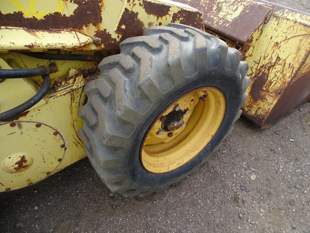 New Holland L-779 Skid Steer Loader, Perkins Diesel, 10-16.5 Tires, 66in Bucket, S/N: 550783