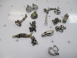 14 Sterling Silver Charms - con 583