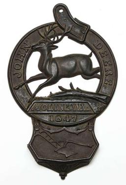 A RARE JOHN DEERE ADVERTISING CAST IRON WALL PLAQUE