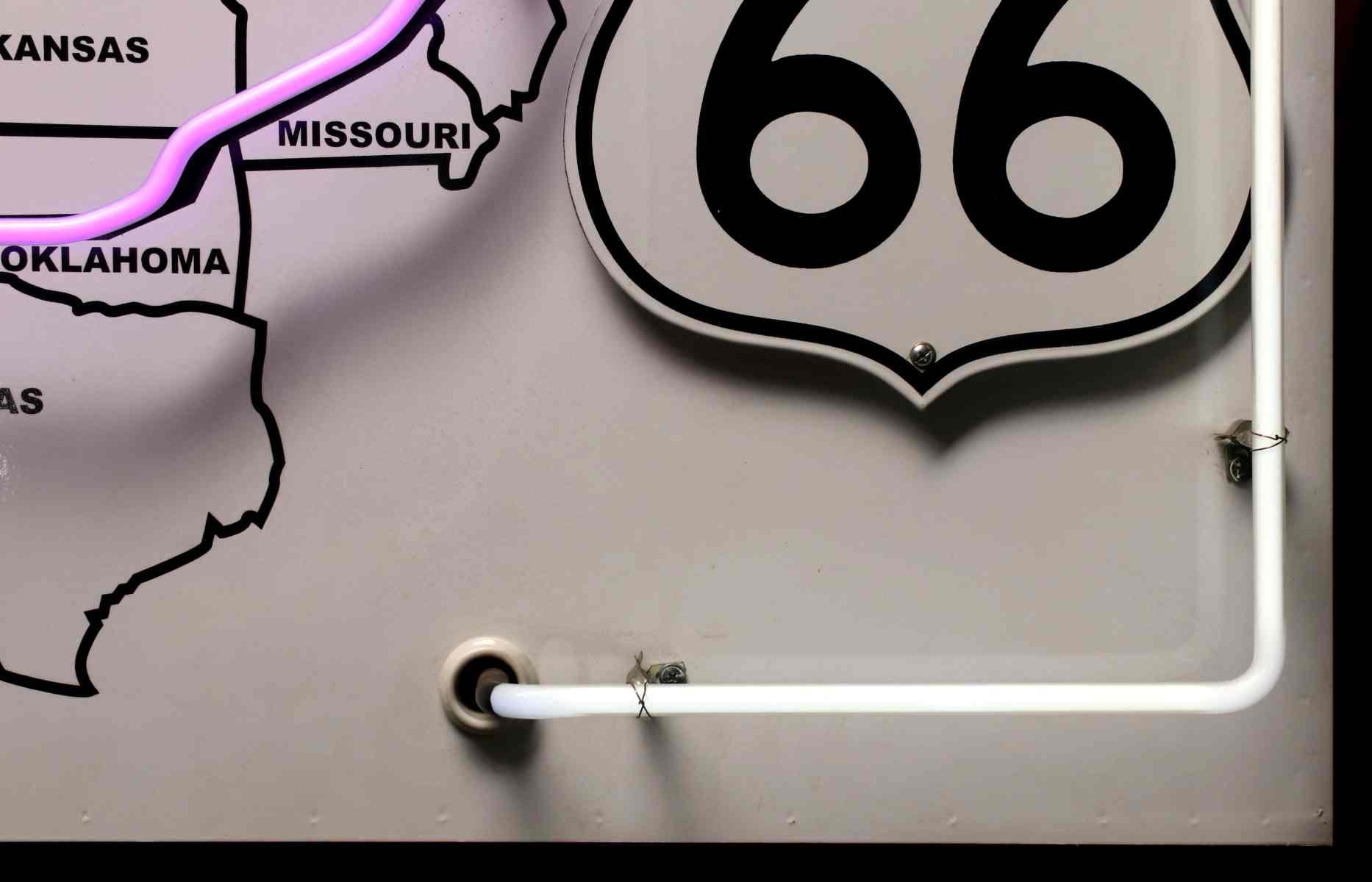 A ROUTE 66 PORCELAIN SIGN WITH NEON