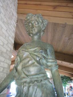 LIFE-SIZE FIGURE ON PEDESTAL WITH WOOD BASE. ONE OF THE FOUR SEASONS BY MAT