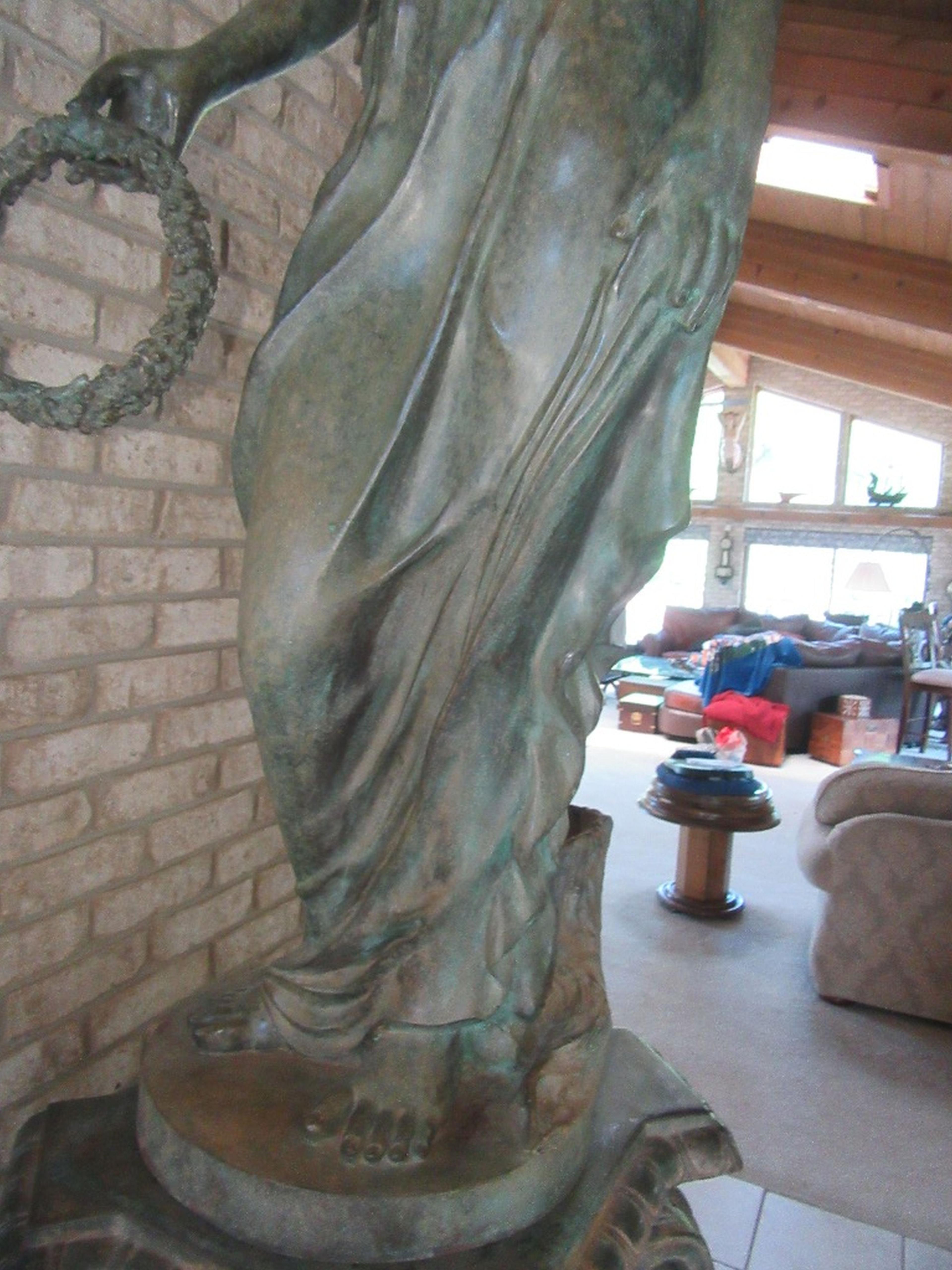 LIFE-SIZE FIGURE ON PEDESTAL WITH WOOD BASE. ONE OF THE FOUR SEASONS BY MAT