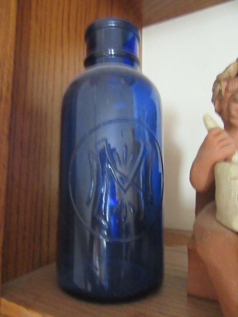 COBALT BLUE PHARMACY JAR AND CLAY PHARMACY FIGURINE