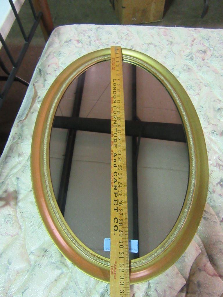 OVAL MIRROR WITH GOLD COLORED FRAME