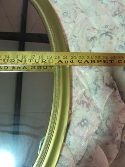 OVAL MIRROR WITH GOLD COLORED FRAME