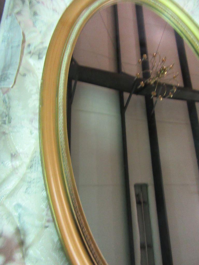 OVAL MIRROR WITH GOLD COLORED FRAME