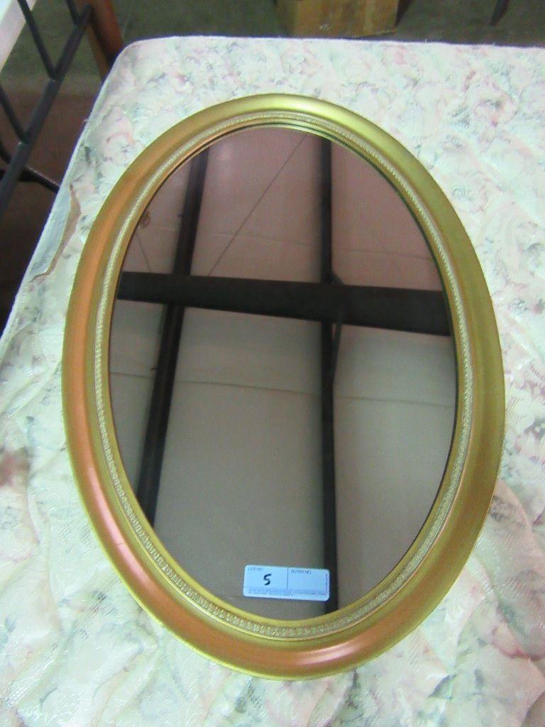 OVAL MIRROR WITH GOLD COLORED FRAME