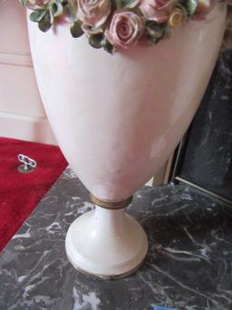 PAIR OF CUPID FLOOR VASES. SOME CHIPS.