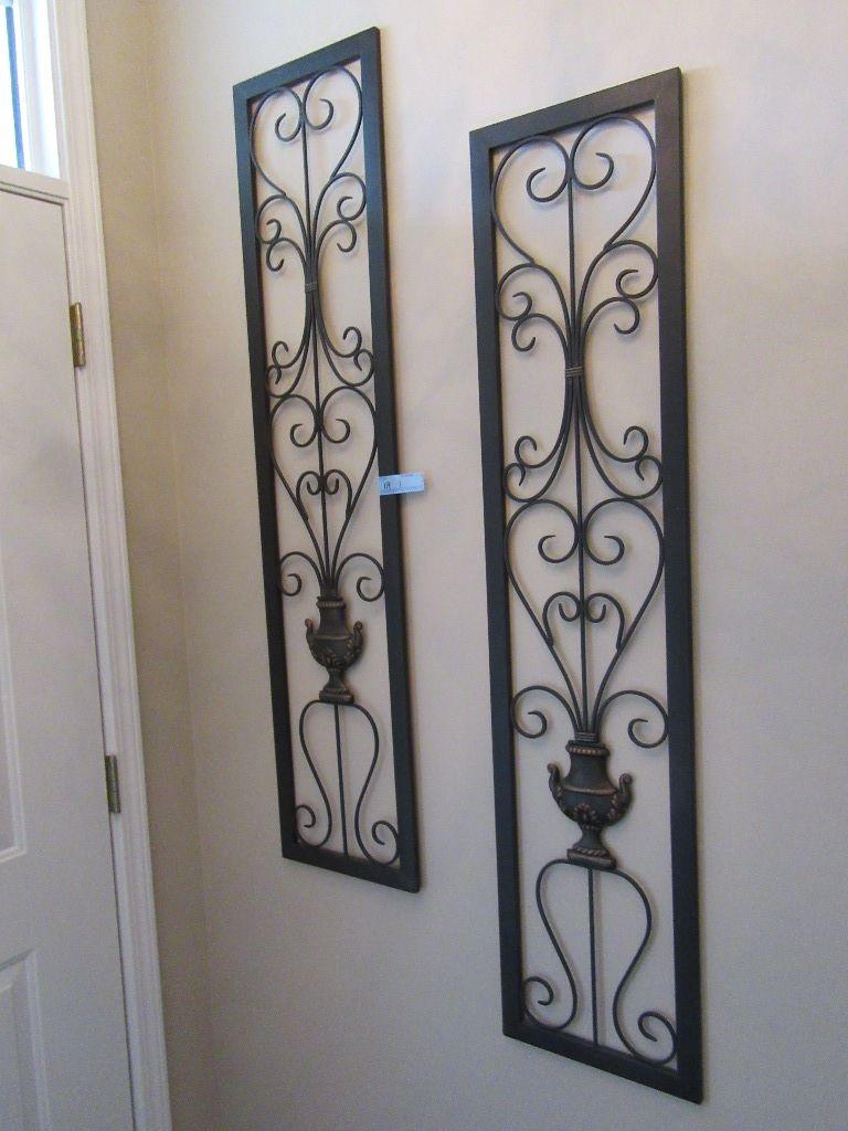 PAIR OF METAL DECORATIVE WALL PLAQUES