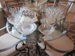 ROUND GLASS TOP TABLE WITH 4 MATCHING CHAIRS. ONE COASTER MISSING