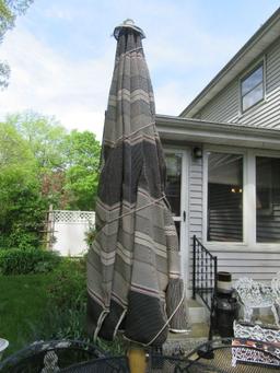 WROUGHT IRON UMBRELLA TABLE AND 4 CHAIRS