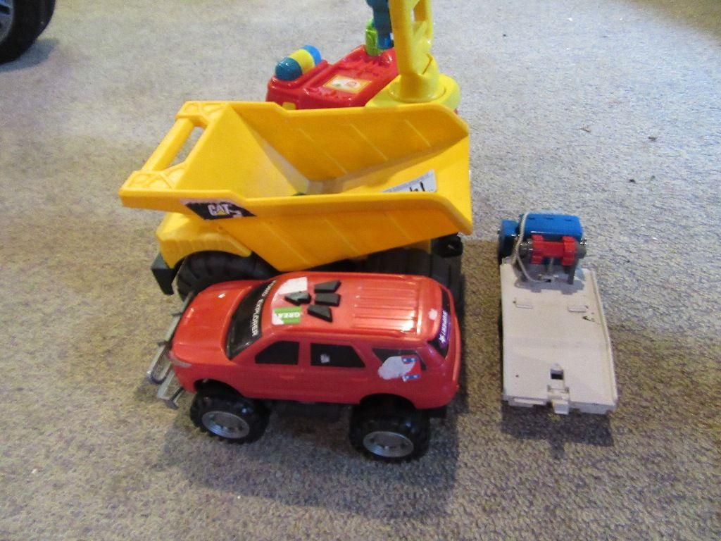 CAT DUMP TRUCK AND OTHER SMALL TRUCKS