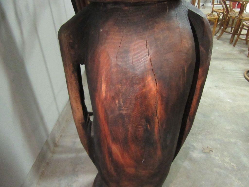 HAND-CARVED WOODEN VASE. APPROXIMATELY 4 FT TALL