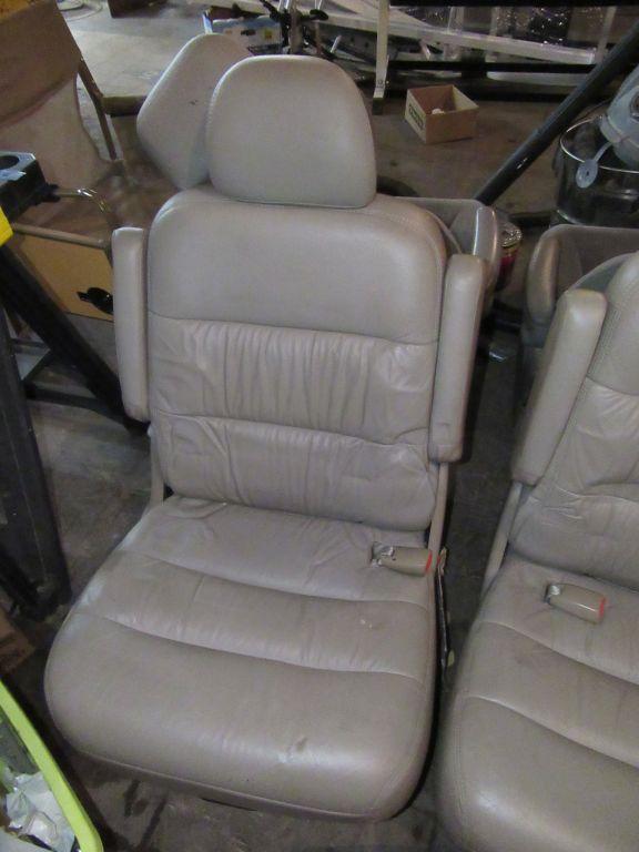 TAN LEATHER VAN SEATS. NOT SURE WHAT THEY FIT