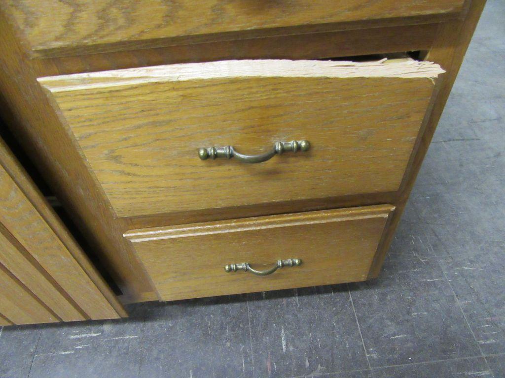 BATHROOM SINK WITH FIXTURE AND CABINET. DRAWER NEEDS REPAIRED.