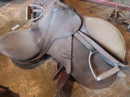 leather saddle with stirrups