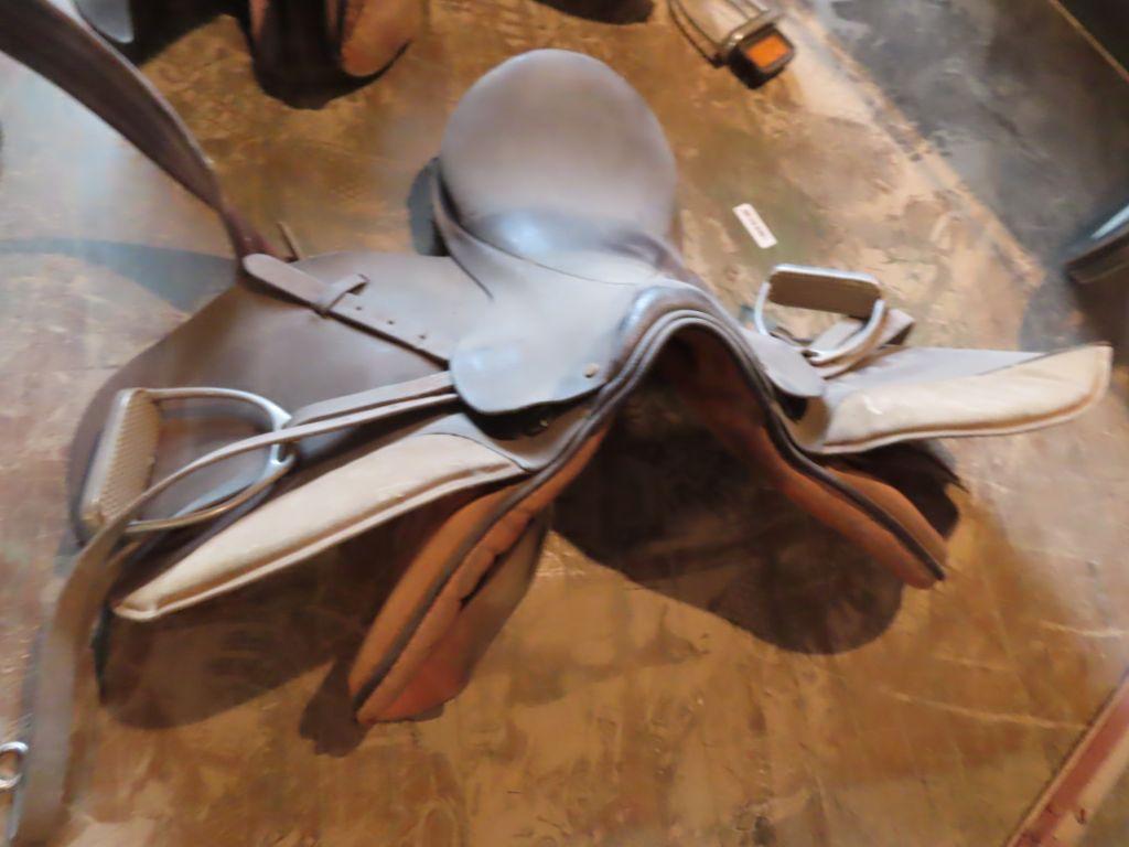 leather saddle with stirrups