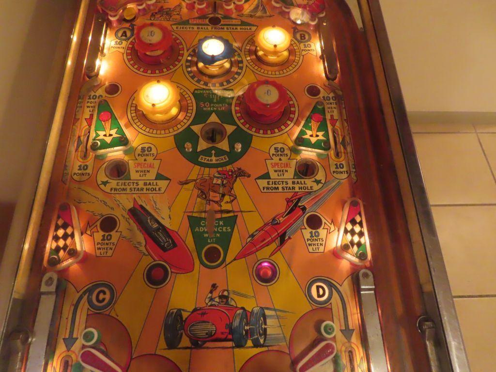 vintage Williams beat the clock pinball machine. in basement. bring tools and help for removal.