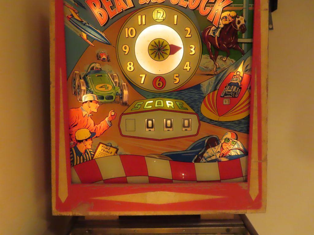 vintage Williams beat the clock pinball machine. in basement. bring tools and help for removal.