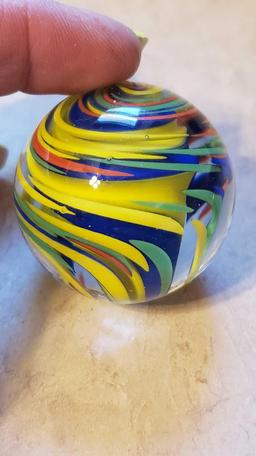 handmade yellow, green, blue, and orange swirl marble signed FES 01. 1-3/4 in