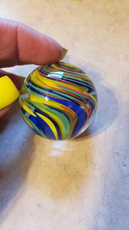 handmade yellow, green, blue, and orange swirl marble signed FES 01. 1-3/4 in