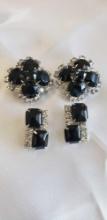 Two pairs of black and clear gemstone clip-on earrings