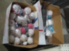 Two boxes of assorted baseballs and stands