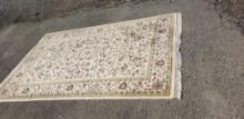 Floral with bird design cream colored rug, 100% genuine wool...pile handmade cottage industry produc