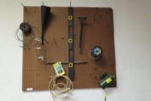 Copper Romex Wire, grinding wheels, level, metal sprayer and Etc on pegboard