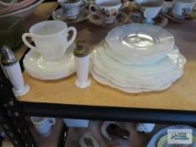 Depression glass plates with creamer and milk glass salt and pepper shakers