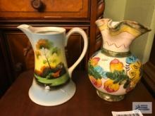 HAND-PAINTED CLAY PITCHER AND HAND-PAINTED TEAPOT. HAS CHIP