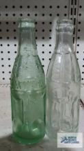 Coca-Cola Bottling Company bottle and Azar Bottling Company bottle