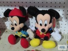 Two Mickey Mouse stuffies