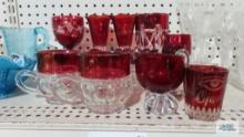 Cranberry and clear glass stemware, creamer and sugar