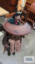 Antique wooden high chair with doll