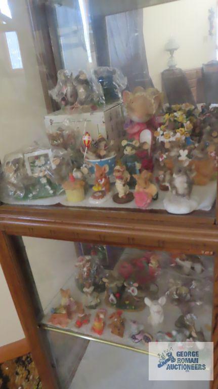 two shelves of mice figurines