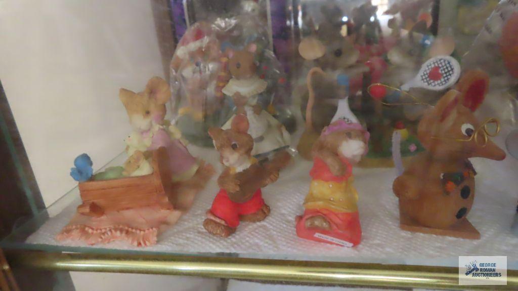 two shelves of mice figurines