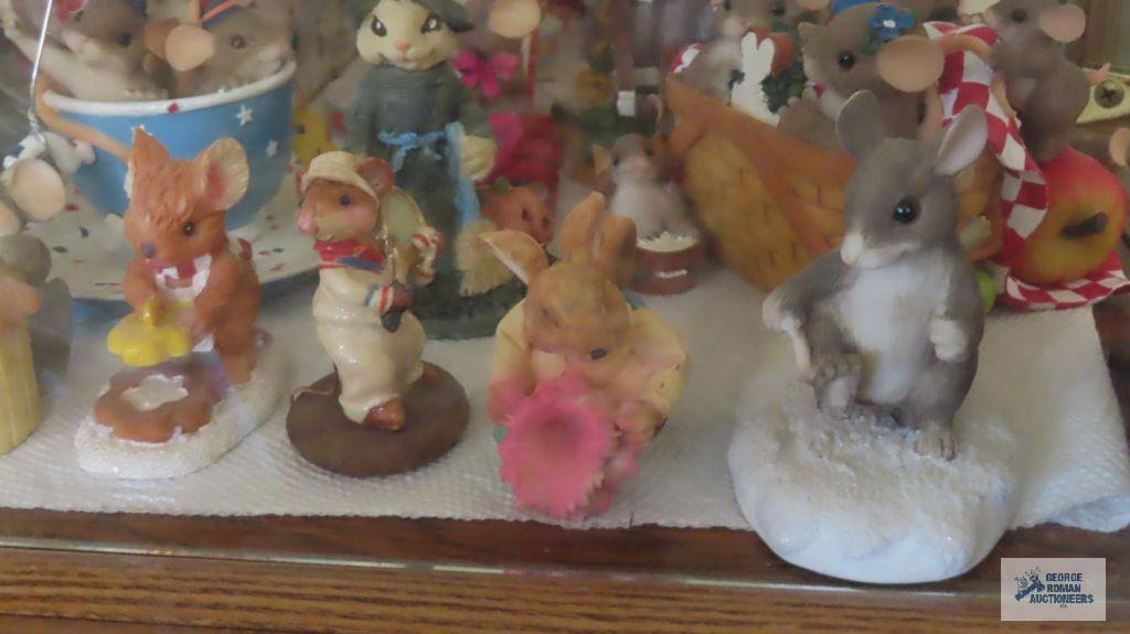 two shelves of mice figurines