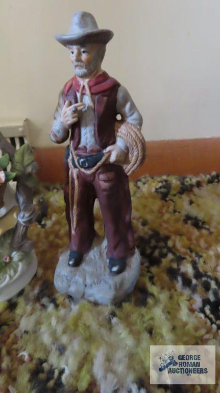 cowboy and Victorian figurines