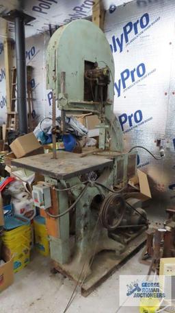 very large heavy duty bandsaw, approximately 7 ft tall. Bring proper equipment for removal and