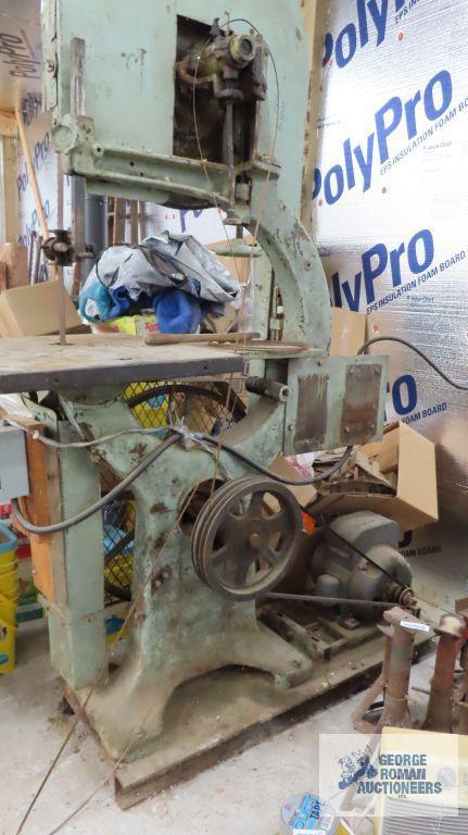 very large heavy duty bandsaw, approximately 7 ft tall. Bring proper equipment for removal and