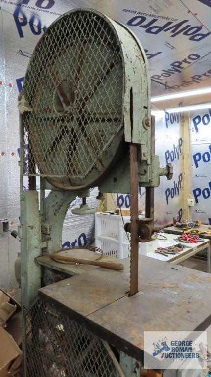 very large heavy duty bandsaw, approximately 7 ft tall. Bring proper equipment for removal and