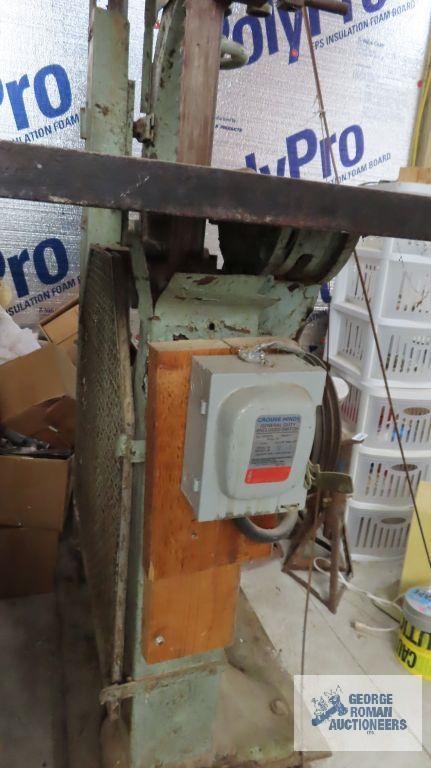 very large heavy duty bandsaw, approximately 7 ft tall. Bring proper equipment for removal and