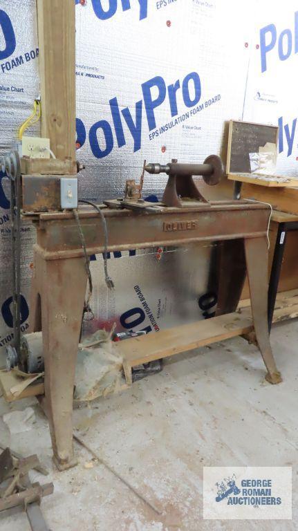 homemade wood lathe on top of vintage Oliver heavy duty table