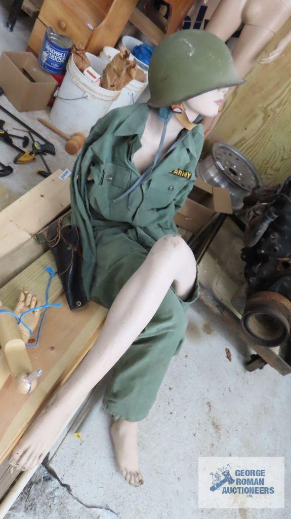 lot of mannequin parts and military clothing with helmet