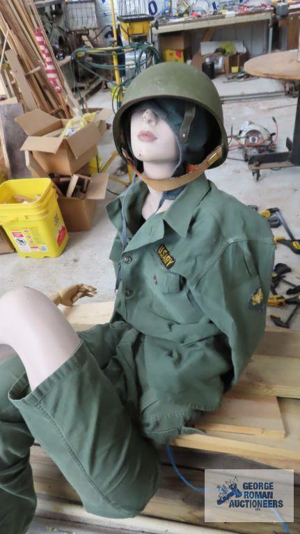 lot of mannequin parts and military clothing with helmet