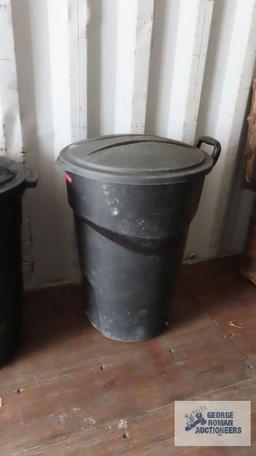 two Rubbermaid trash cans with lids